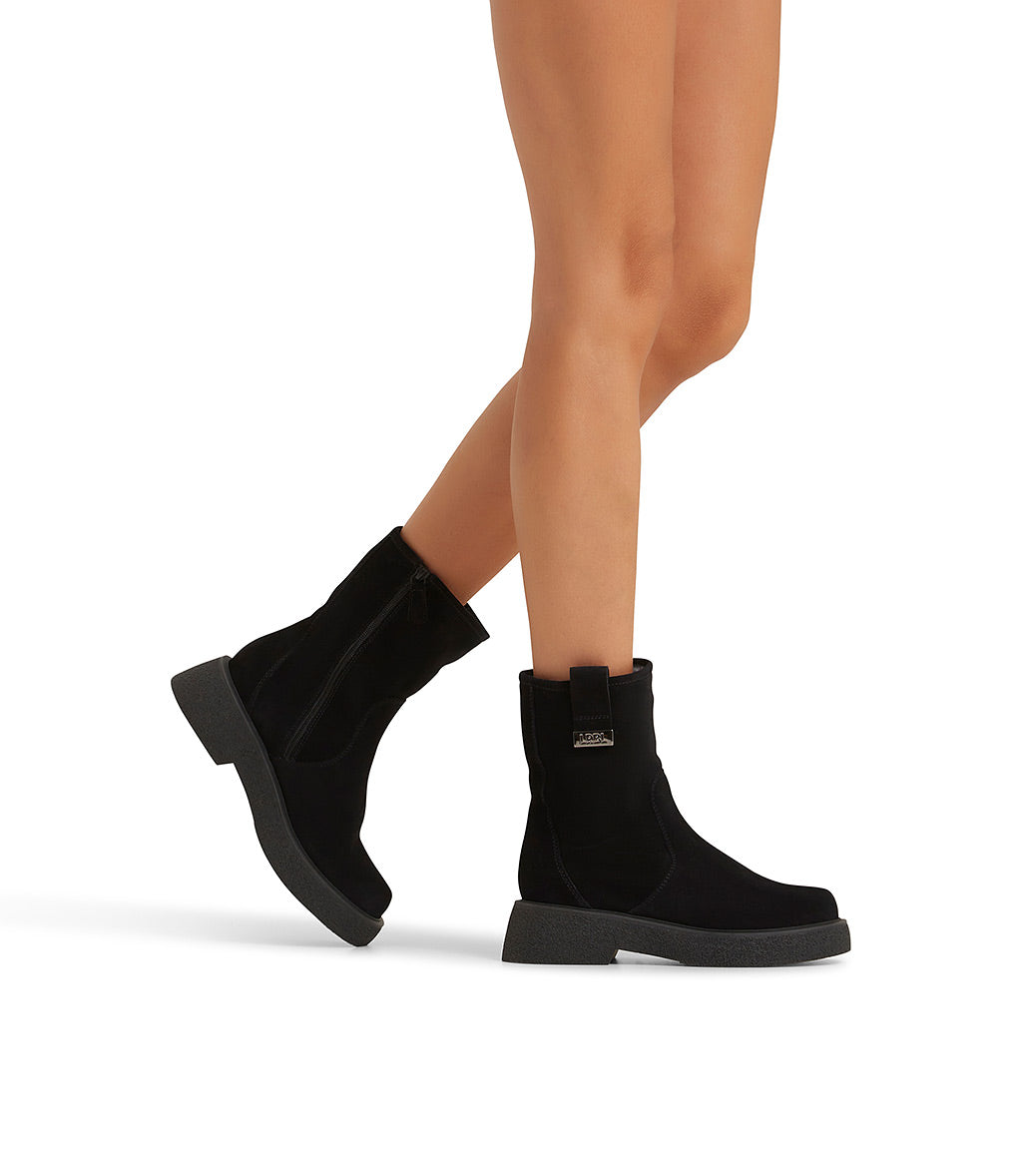 Black suede and shearling ankle boots